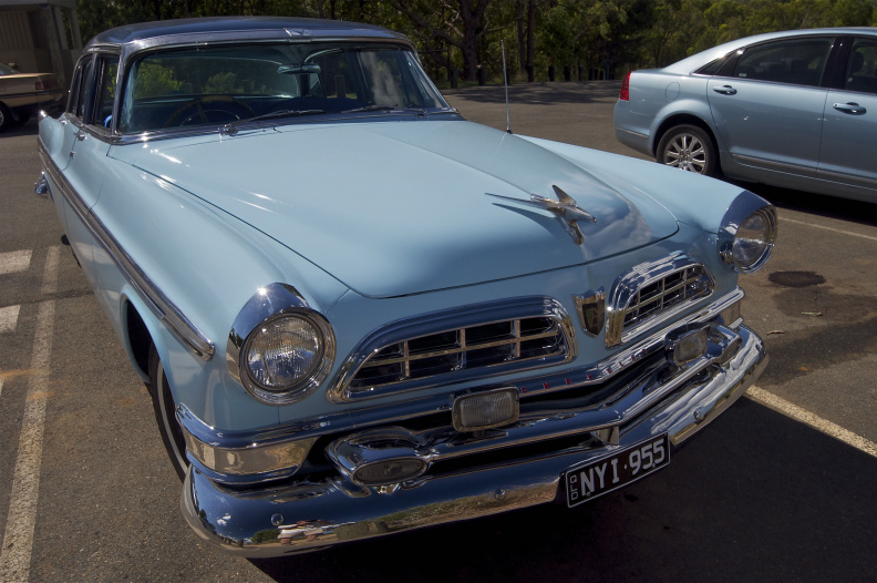 A 1955 Chrysler New Yorker, seen in the Glasshouse Mountains Lookout parking lot, Queensland