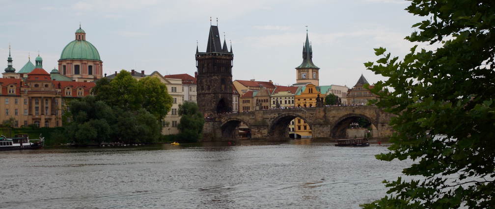 Looking across the Vltava River towards the Charles Bridge and old town Prague