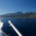 Taking a ferry from the island of Tahiti...