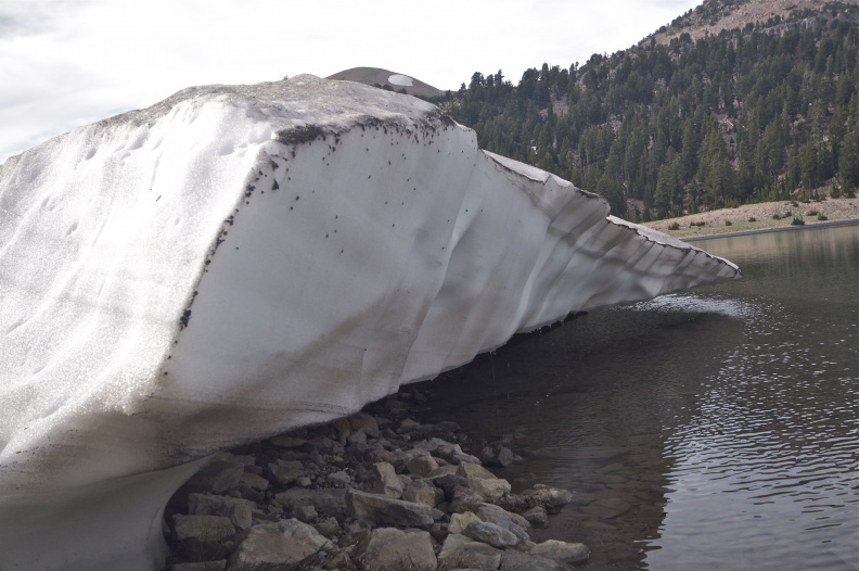Residual snow patch overhanging Lake Helen