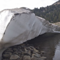 Residual snow patch overhanging Lake Helen
