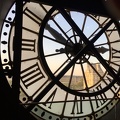 Looking through the clock from inside the Orsay Museum at sunset