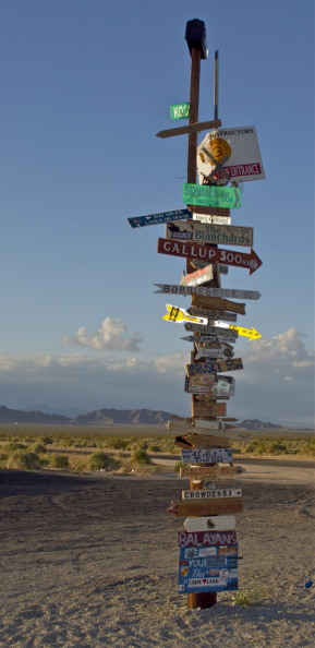 A funky sign sitting in the middle of the Mojave Desert, California